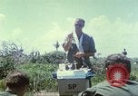 Image of Chaplain ministering to 199th Light Infantry Brigade South Vietnam, 1968, second 14 stock footage video 65675062056