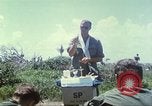 Image of Chaplain ministering to 199th Light Infantry Brigade South Vietnam, 1968, second 15 stock footage video 65675062056