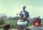 Image of Chaplain ministering to 199th Light Infantry Brigade South Vietnam, 1968, second 16 stock footage video 65675062056