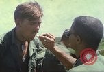 Image of Chaplain ministering to 199th Light Infantry Brigade South Vietnam, 1968, second 53 stock footage video 65675062056