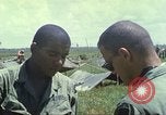 Image of Chaplain ministering to 199th Light Infantry Brigade South Vietnam, 1968, second 56 stock footage video 65675062056