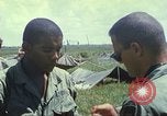 Image of Chaplain ministering to 199th Light Infantry Brigade South Vietnam, 1968, second 57 stock footage video 65675062056