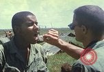 Image of Chaplain ministering to 199th Light Infantry Brigade South Vietnam, 1968, second 58 stock footage video 65675062056