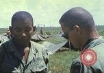 Image of Chaplain ministering to 199th Light Infantry Brigade South Vietnam, 1968, second 59 stock footage video 65675062056