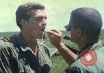 Image of Chaplain ministering to 199th Light Infantry Brigade South Vietnam, 1968, second 62 stock footage video 65675062056