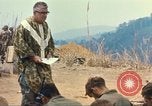Image of catholic chaplain Vietnam, 1968, second 61 stock footage video 65675062058