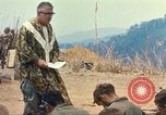 Image of catholic chaplain Vietnam, 1968, second 62 stock footage video 65675062058