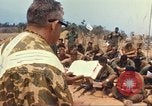 Image of catholic chaplain Vietnam, 1968, second 45 stock footage video 65675062059