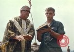 Image of catholic chaplain Vietnam, 1968, second 49 stock footage video 65675062059