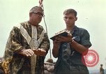 Image of catholic chaplain Vietnam, 1968, second 50 stock footage video 65675062059