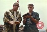 Image of catholic chaplain Vietnam, 1968, second 51 stock footage video 65675062059