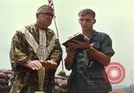 Image of catholic chaplain Vietnam, 1968, second 52 stock footage video 65675062059