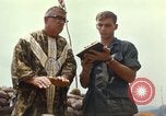 Image of catholic chaplain Vietnam, 1968, second 53 stock footage video 65675062059