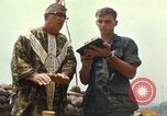 Image of catholic chaplain Vietnam, 1968, second 54 stock footage video 65675062059