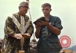 Image of catholic chaplain Vietnam, 1968, second 56 stock footage video 65675062059