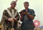 Image of catholic chaplain Vietnam, 1968, second 57 stock footage video 65675062059