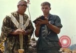 Image of catholic chaplain Vietnam, 1968, second 58 stock footage video 65675062059