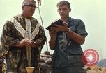 Image of catholic chaplain Vietnam, 1968, second 59 stock footage video 65675062059
