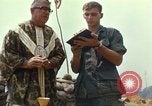 Image of catholic chaplain Vietnam, 1968, second 60 stock footage video 65675062059