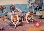 Image of U.S. Coast Guardsmen perform maintenance on LST  Iwo Jima, 1945, second 3 stock footage video 65675062154