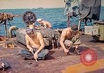 Image of U.S. Coast Guardsmen perform maintenance on LST  Iwo Jima, 1945, second 4 stock footage video 65675062154