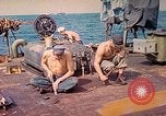 Image of U.S. Coast Guardsmen perform maintenance on LST  Iwo Jima, 1945, second 6 stock footage video 65675062154