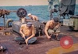 Image of U.S. Coast Guardsmen perform maintenance on LST  Iwo Jima, 1945, second 8 stock footage video 65675062154