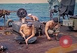Image of U.S. Coast Guardsmen perform maintenance on LST  Iwo Jima, 1945, second 9 stock footage video 65675062154