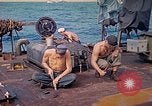 Image of U.S. Coast Guardsmen perform maintenance on LST  Iwo Jima, 1945, second 10 stock footage video 65675062154