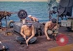 Image of U.S. Coast Guardsmen perform maintenance on LST  Iwo Jima, 1945, second 11 stock footage video 65675062154