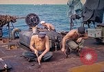 Image of U.S. Coast Guardsmen perform maintenance on LST  Iwo Jima, 1945, second 12 stock footage video 65675062154