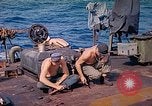Image of U.S. Coast Guardsmen perform maintenance on LST  Iwo Jima, 1945, second 13 stock footage video 65675062154