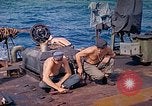 Image of U.S. Coast Guardsmen perform maintenance on LST  Iwo Jima, 1945, second 14 stock footage video 65675062154