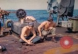 Image of U.S. Coast Guardsmen perform maintenance on LST  Iwo Jima, 1945, second 16 stock footage video 65675062154