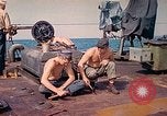 Image of U.S. Coast Guardsmen perform maintenance on LST  Iwo Jima, 1945, second 17 stock footage video 65675062154