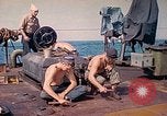 Image of U.S. Coast Guardsmen perform maintenance on LST  Iwo Jima, 1945, second 19 stock footage video 65675062154