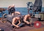 Image of U.S. Coast Guardsmen perform maintenance on LST  Iwo Jima, 1945, second 20 stock footage video 65675062154