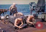 Image of U.S. Coast Guardsmen perform maintenance on LST  Iwo Jima, 1945, second 21 stock footage video 65675062154