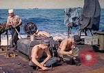 Image of U.S. Coast Guardsmen perform maintenance on LST  Iwo Jima, 1945, second 22 stock footage video 65675062154