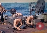 Image of U.S. Coast Guardsmen perform maintenance on LST  Iwo Jima, 1945, second 23 stock footage video 65675062154
