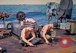 Image of U.S. Coast Guardsmen perform maintenance on LST  Iwo Jima, 1945, second 24 stock footage video 65675062154