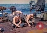 Image of U.S. Coast Guardsmen perform maintenance on LST  Iwo Jima, 1945, second 25 stock footage video 65675062154