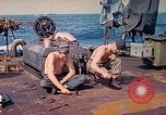 Image of U.S. Coast Guardsmen perform maintenance on LST  Iwo Jima, 1945, second 26 stock footage video 65675062154
