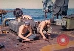 Image of U.S. Coast Guardsmen perform maintenance on LST  Iwo Jima, 1945, second 30 stock footage video 65675062154