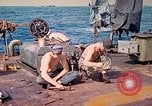 Image of U.S. Coast Guardsmen perform maintenance on LST  Iwo Jima, 1945, second 32 stock footage video 65675062154