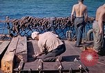 Image of U.S. Coast Guardsmen perform maintenance on LST  Iwo Jima, 1945, second 33 stock footage video 65675062154