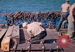 Image of U.S. Coast Guardsmen perform maintenance on LST  Iwo Jima, 1945, second 34 stock footage video 65675062154