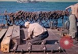 Image of U.S. Coast Guardsmen perform maintenance on LST  Iwo Jima, 1945, second 35 stock footage video 65675062154