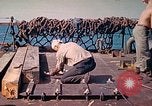 Image of U.S. Coast Guardsmen perform maintenance on LST  Iwo Jima, 1945, second 37 stock footage video 65675062154