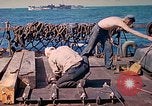 Image of U.S. Coast Guardsmen perform maintenance on LST  Iwo Jima, 1945, second 38 stock footage video 65675062154
